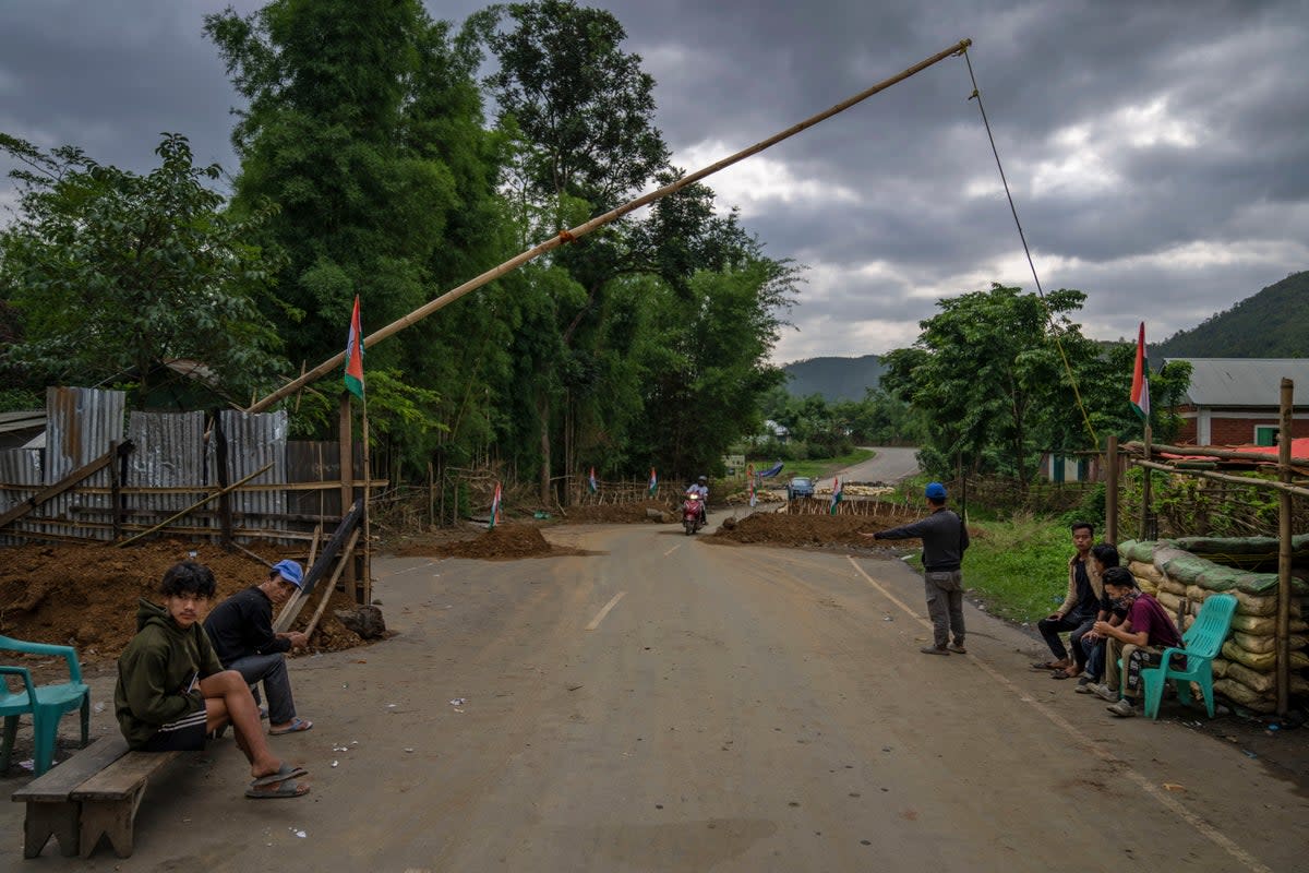 Tribal Kuki community volunteers man a checkpoint between two ethnic zones in Churachandpur, in Manipur state, in June.  (AP)