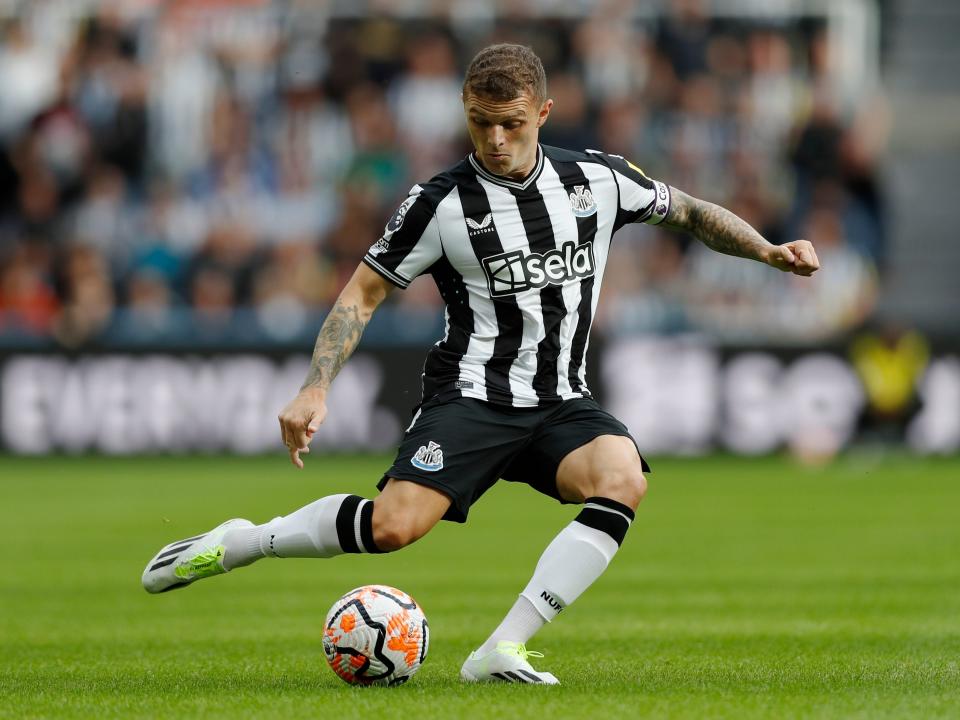 Newcastle's Kieran Trippier passes the ball during the English Premier League soccer match between Newcastle and Aston Villa at St. James' Park in Newcastle, England, Saturday, Aug. 12, 2023. Newcastle won 5-1. (AP Photo/Steve Luciano)