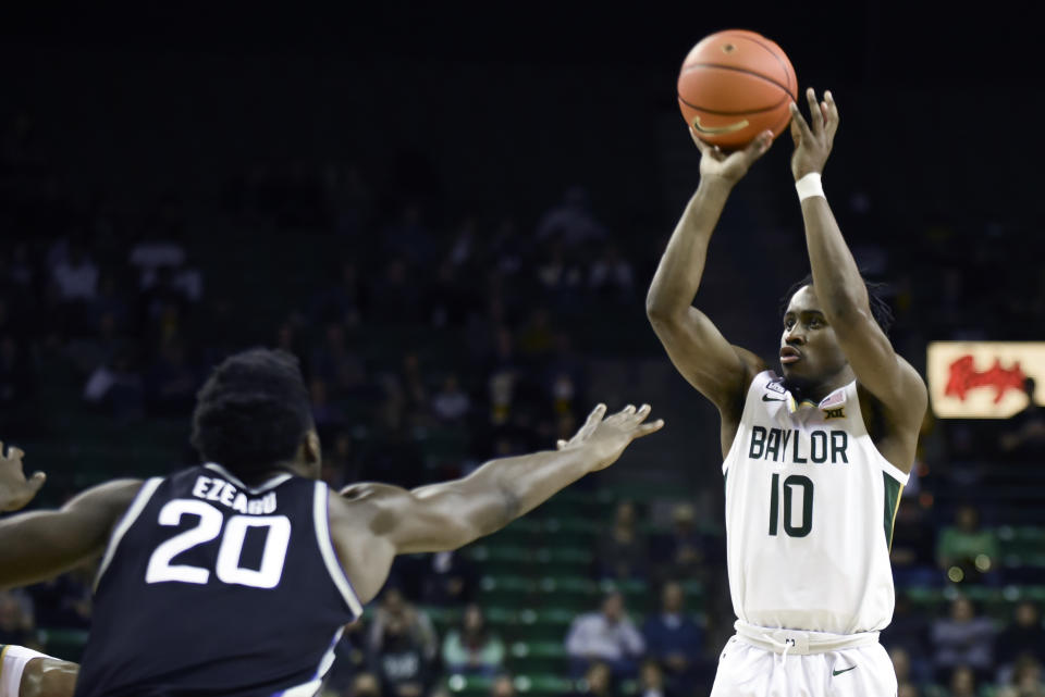 Baylor guard Adam Flagler (10) shoots a three-pointer over Kansas State forward Kaosi Ezeagu (20) in the first half of an NCAA college basketball game in Waco, Texas, Tuesday, Jan. 25, 2022. (AP Photo/Emil Lippe)