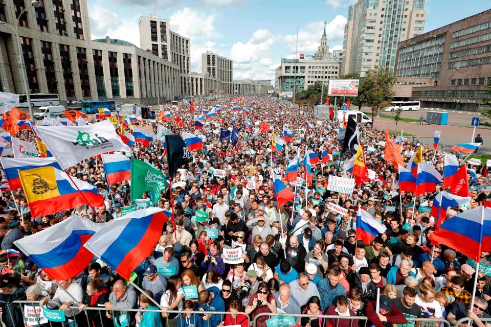 Demonstrators take part in a rally on July 20, 2019, in Moscow to support opposition and independent candidates after authorities refused to register them for September elections to the Moscow City Duma.