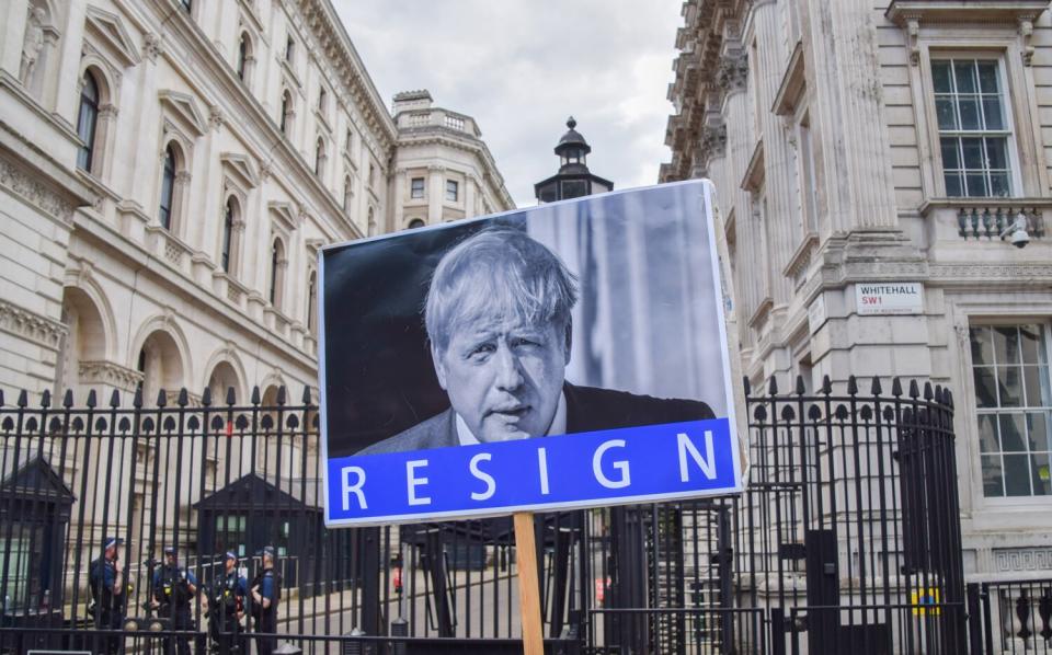 A placard calling on Boris Johnson to resign is seen during the demonstration. Anti Boris Johnson protesters gathered outside Downing Street ahead of the planned publication of the Sue Gray report, as the Metropolitan Police concludes its investigation of the Partygate scandal with just one fine for the Prime Minister.