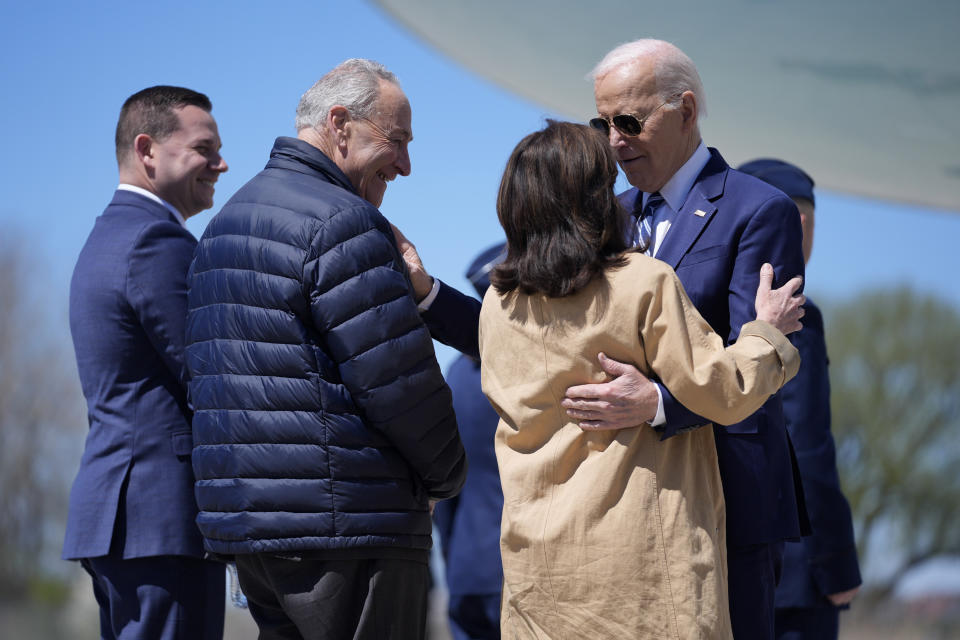 President Joe Biden, from right, is greeted by New York Gov. Kathy Hochul, Senate Majority Leader Chuck Schumer, D-N.Y., and County Executive Ryan McMahon, as he arrives at Hancock Field Air National Guard Base, Thursday, April 25, 2024, in Syracuse, N.Y. (AP Photo/Evan Vucci)