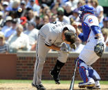 CHICAGO, IL - MAY 18: Paul Konerko #14 of the Chicago White Sox is hit in the face by a pitch in the third inning as Welington Castillo #54 of the Chicago Cubs looks on May 18 2012 at Wrigley Field in Chicago, Illinois. Konerko had to leave the game. (Photo by David Banks/Getty Images)