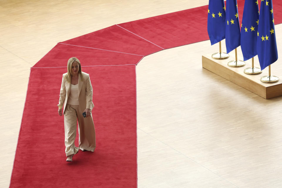 FILE - Italy's Premier Giorgia Meloni arrives for an EU summit at the European Council building in Brussels, Thursday, June 29, 2023. When Giorgia Meloni took office a year ago as the first far-right premier in Italy's post-war history, concern was palpable abroad about the prospect of democratic backsliding and resistance to European Union rules. But since being sworn in as premier on Oct. 22, 2022, Meloni has confounded Western skeptics. (AP Photo/Geert Vanden Wijngaert, File)