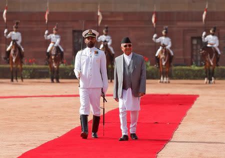 Nepal's Prime Minister Khadga Prasad Sharma Oli inspects a guard of honour during his ceremonial reception at the forecourt of India's Rashtrapati Bhavan presidential palace in New Delhi, India, April 7, 2018. REUTERS/Altaf Hussain