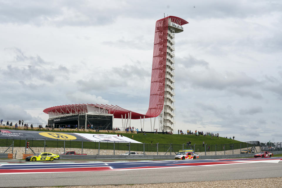 Austin Cindric (22) leads Justin Allgaier (7) and Kyle Busch (54) out of Turn 18 during the NASCAR Xfinity Series auto race at the Circuit of the Americas in Austin, Texas, Saturday, May 22, 2021. (AP Photo/Chuck Burton)