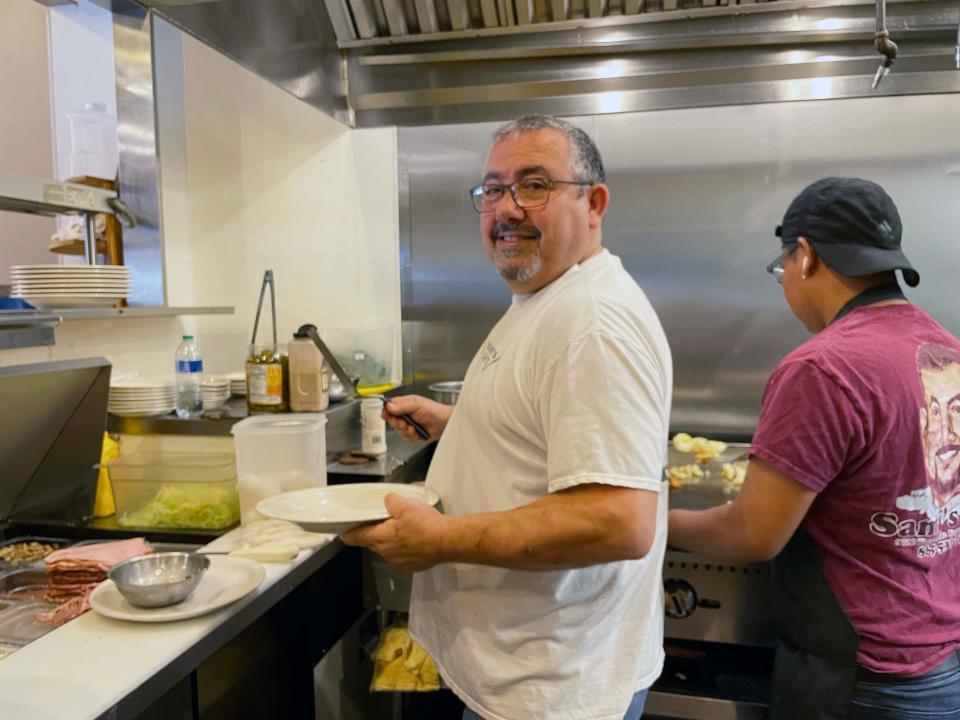 Owner Bassam (Sam) Natour is quick on the grill at Sami’s Café, 9700 Kingston Pike, Tuesday, July 5, 2022.