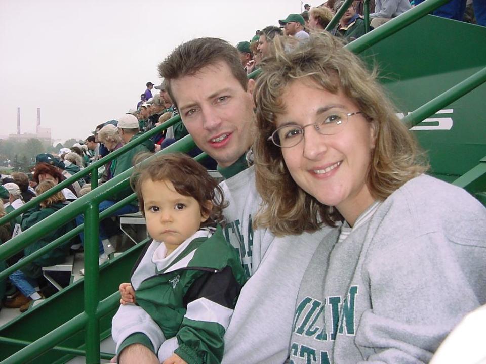 A young ABH sports reporter Sara Tidwell with her family at a Michigan State sporting event.