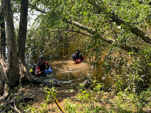 This photo shows dive teams checking the debris field in the mouth of the Delaware River where Houghs Creek empties into it