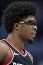 Portland Trail Blazers guard Scoot Henderson looks on during the first half of an NBA basketball game against the Charlotte Hornets Wednesday, April 3, 2024, in Charlotte, N.C. (AP Photo/Jacob Kupferman)