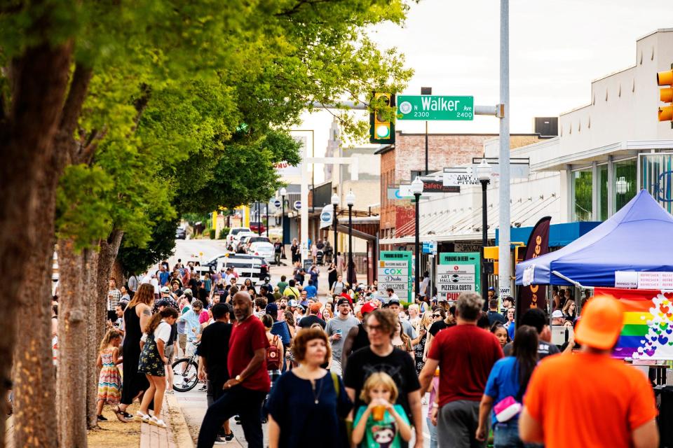 Crowds explore the Uptown 23rd District during the 2022 Uptown Outside block party.