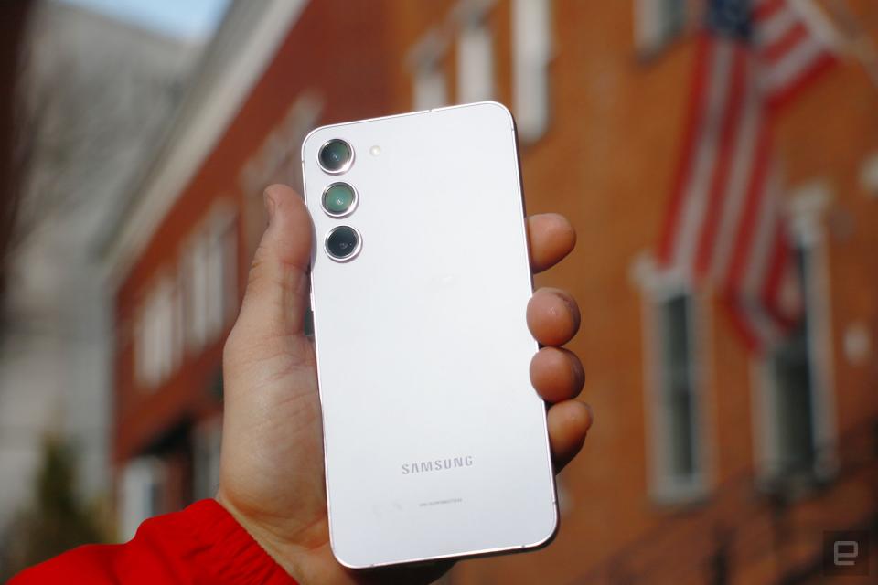 The Galaxy S23 Plus held in mid-air. 