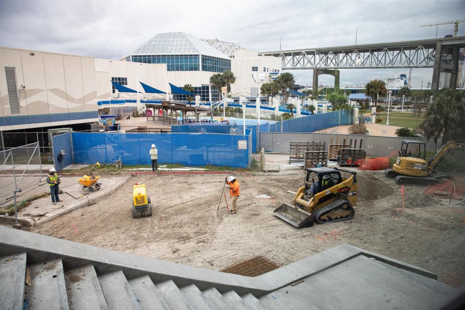 A construction crew uses a remote controlled robot to compact the ground for paving, surrounding the public entrance to the Texas State Aquarium's new Port of Corpus Christi Center for Wildlife Rescue, on Jan. 27, 2023, in Corpus Christi, Texas.