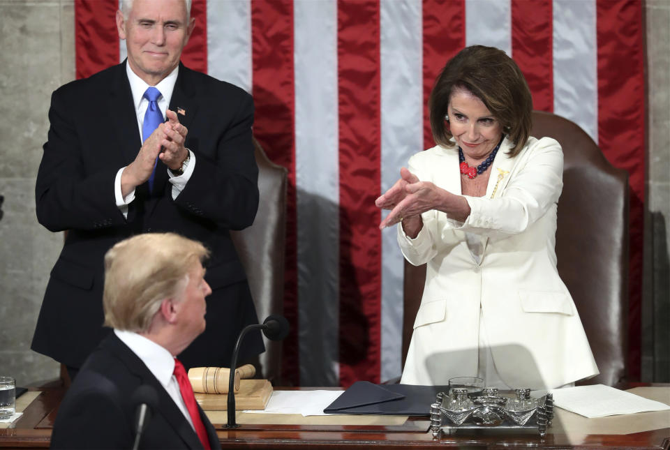 FILE - In this Feb. 5, 2019 file photo, President Donald Trump turns to House Speaker Nancy Pelosi of Calif., as he delivers his State of the Union address to a joint session of Congress on Capitol Hill in Washington, as Vice President Mike Pence watches. (AP Photo/Andrew Harnik)