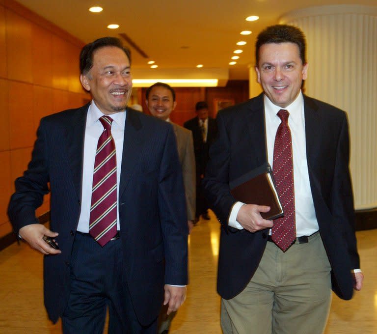 Nick Xenophon (R) with opposition leader Anwar Ibrahim in Kuala Lumpur in 2010. Malaysia detained Australian politician Xenophon at Kuala Lumpur airport Saturday, branding him a "prohibited immigrant" ahead of his expected deportation, in a move Canberra described as "disappointing"