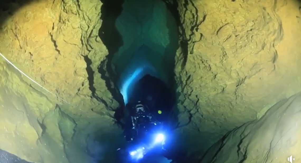 Divers exploring Phantom Springs Cave.