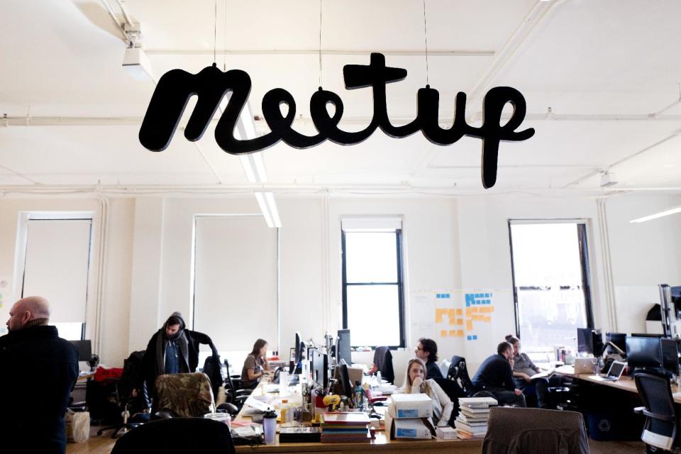 In this March 13, 2017 photo, staff members of Meetup are at work in the company's New York office. Meetup.com is taking a leap into the Trump resistance. It's a risky move for the company, whose millions of U.S. members include many Trump supporters. But the decision reflects an increasing willingness of some major tech firms to take on the Republican president. (AP Photo/Mark Lennihan)