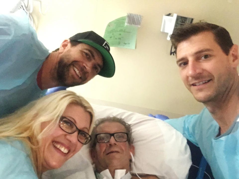 This June 16, 2019, photo provided by Jessee Ernest shows his father Paul Ernest, center, surrounded by family members at Vibra Hospital in Folsom, Calif. Ernest is joined by his sons Jessee, top left, Jake and his daughter, Arielle. Paul Ernest, who had been hospitalized since the deadliest wildfire in California history incinerated a town in November has died, raising the number of people killed to 86, authorities said Thursday, Aug. 8. (Jessee Ernest via AP)