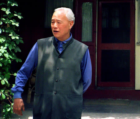 FILE PHOTO: Toppled Chinese reformist leader, Zhao Ziyang strolls in the garden of his home in central Beijing, China, early June 1998. REUTERS/Stringer/File Photo