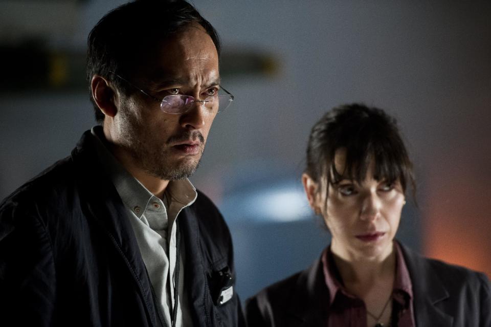 This film image released by Warner Bros. Pictures shows Ken Watanabe, left, and Sally Hawkins in a scene from "Godzilla." (AP Photo/Warner Bros. Pictures, Kimberley French)