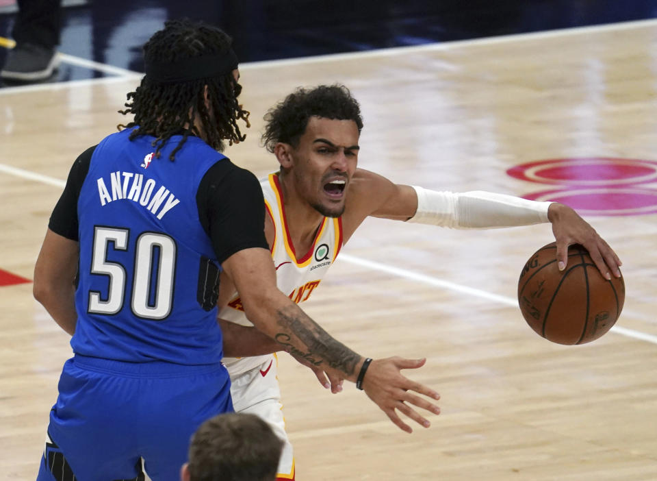 Orlando Magic guard Cole Anthony (50) defends against Atlanta Hawks guard Trae Young (11) in the second half of an NBA basketball game Thursday, May 13, 2021 in Atlanta. (AP Photo/Tami Chappel)