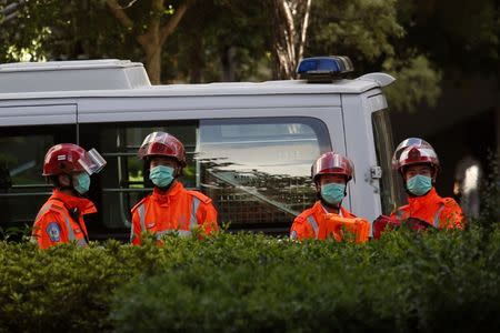 Rescuers are on standby after a woman opened fire and wounded four people at a park outside Taikoo Shing in Hong Kong, China June 26, 2018. REUTERS/Bobby Yip