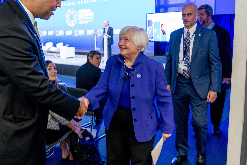 Treasury Secretary Janet Yellen, speaks with a member of the audience as she departs after speaking during the 2022 annual meeting of the IMF and the World Bank Group in Washington, Wednesday, Oct. 12, 2022. (AP Photo/Andrew Harnik)