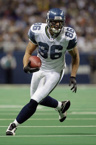 <p>Elsa/Getty</p> Jerramy Stevens playing football for the Seattle Seahawks in 2003