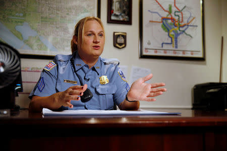 Washington Metropolitan Police Department Sergeant Jessica Hawkins, a transgender woman who leads the department's lesbian, gay, bisexual and transgender (LGBT) unit, speaks about her work at her office in Washington, U.S. October 10, 2016. REUTERS/Jonathan Ernst