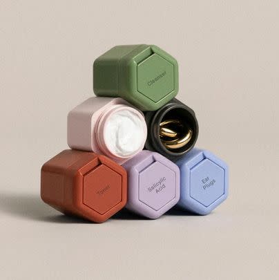 OR a set of magnetic Cadence containers for storing toiletries