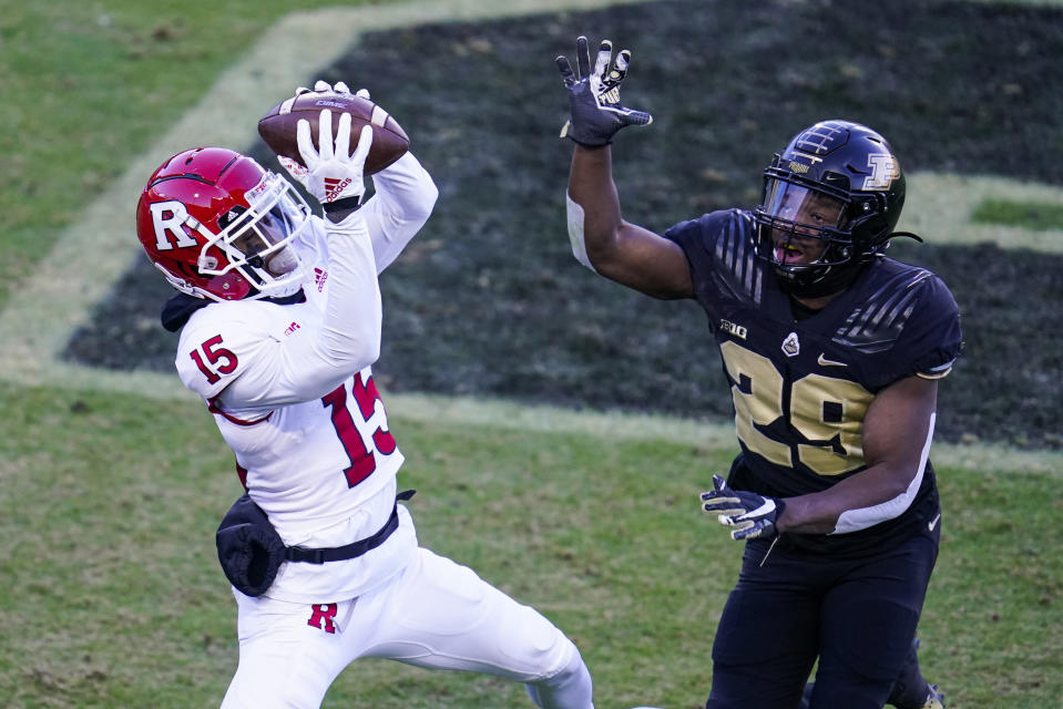 Rutgers wide receiver Shameen Jones (15) makes a catch in front of Purdue cornerback Simeon Smiley (29) for a touchdown during the first quarter of an NCAA college football game in West Lafayette, Ind., Saturday, Nov. 28, 2020. (AP Photo/Michael Conroy)