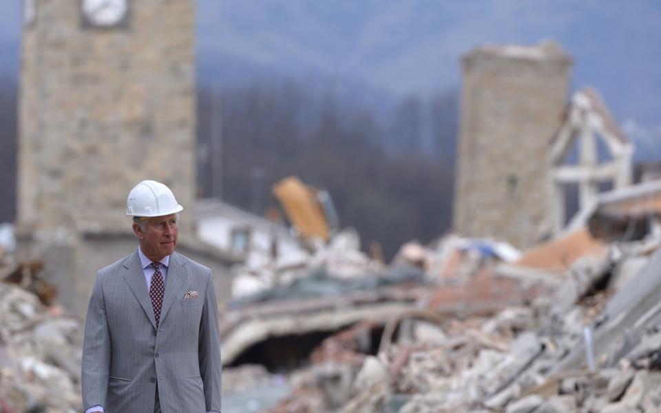 Prince Charles, Prince of Wales, visits the Italian quake-hit town of Amatrice on April 2, 2017 as part of his European tour aimed at strengthening relations with EU allies post Brexit - Credit: AFP