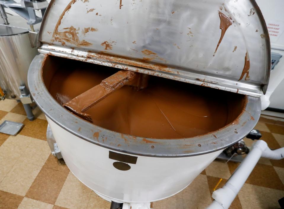 A tank of melted chocolate is seen on Friday, December 15, 2023, at SeroogyÕs Chocolates in De Pere, Wis. 
Tork Mason/USA TODAY NETWORK-Wisconsin