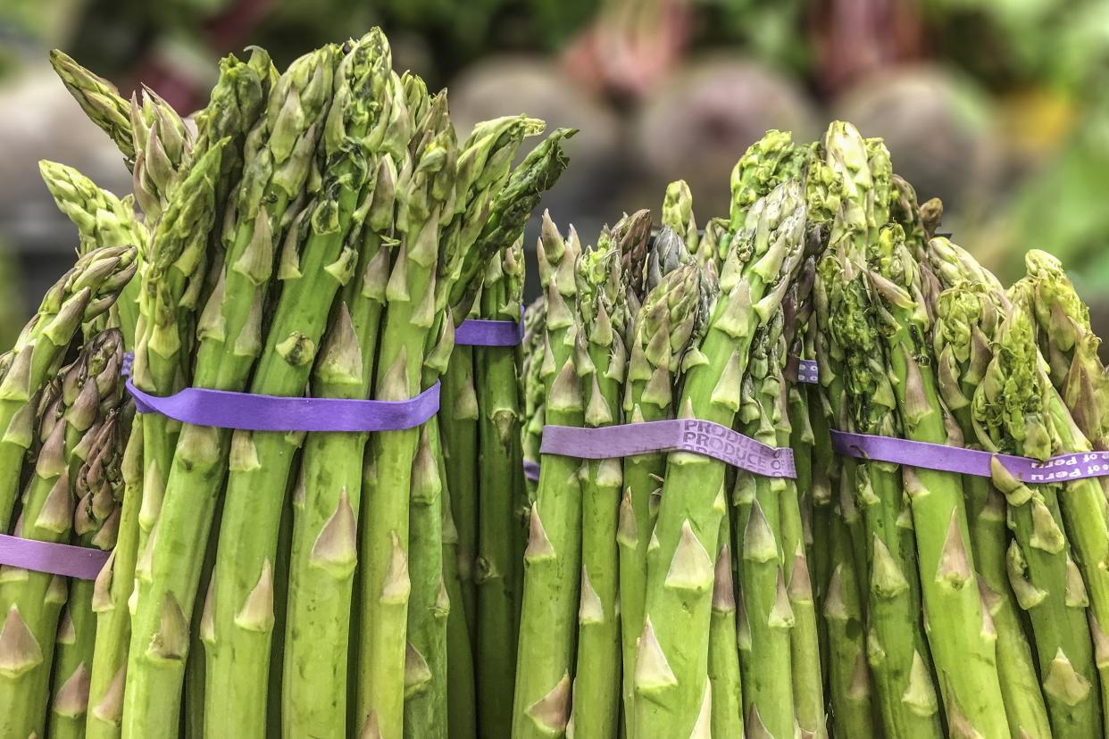 bunched asparagus with rubber bands at grocery store