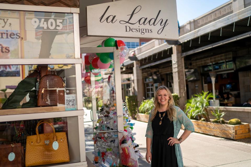 Brittney Ullman stands in front of her shop La Lady Designs on Black Friday at Westgate Entertainment District on Friday, Nov. 26, 2021, in Glendale. Ullman has owned the boutique for nearly 12 years, 