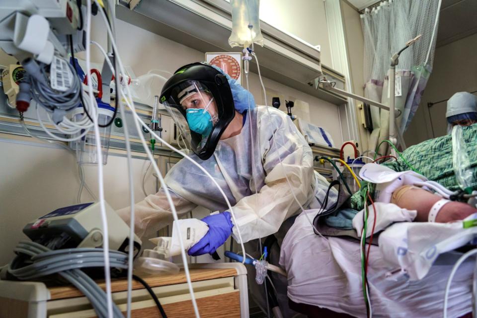 Nurse practitioner Charlotte Thomas readies her supplies