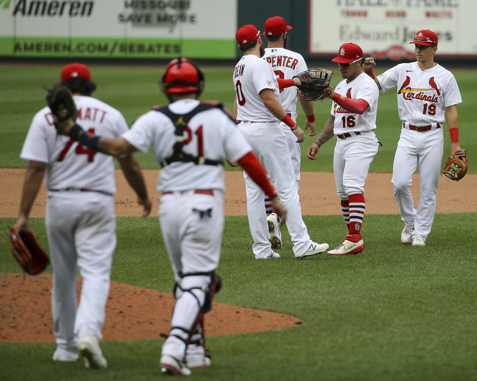 Members of the St. Louis Cardinals celebrate after defeating the Detroit Tigers in the first game of a baseball doubleheader Thursday, Sept. 10, 2020, in St. Louis. (AP Photo/Scott Kane)