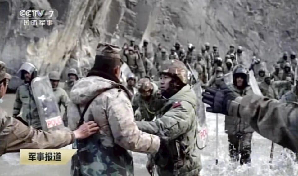 In this image taken from video footage run Feb. 19, 2021 by China's CCTV via AP Video, Indian and Chinese troops face off in the Galwan Valley on the disputed border between China and India, June 15, 2020. China's military said Friday, Feb. 19, 2021 that four of its soldiers were killed in a high-mountain border clash with Indian forces last year, the first time Beijing has publicly conceded its side suffered casualties in the deadliest incident between the Asian giants in nearly 45 years. (CCTV via AP Video)