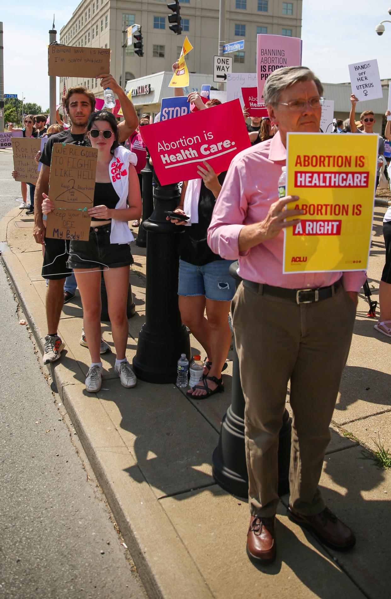 Protesters hold up signs to support abortion rights during a rally in downtown Louisville, Ky. on June 24, 2022. This comes after the Supreme Court's decision to overturn Roe V. Wade.