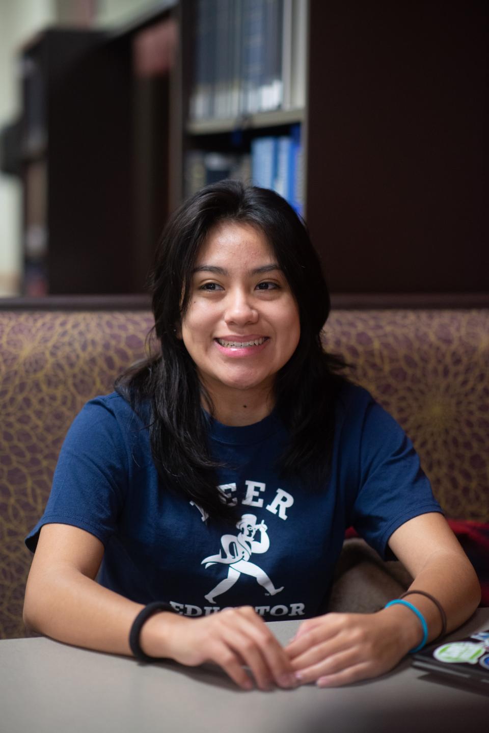 A smile washes over Washburn senior Perla Soto as she talks about her experiences that brought her to the university Wednesday morning at Mabee Library.