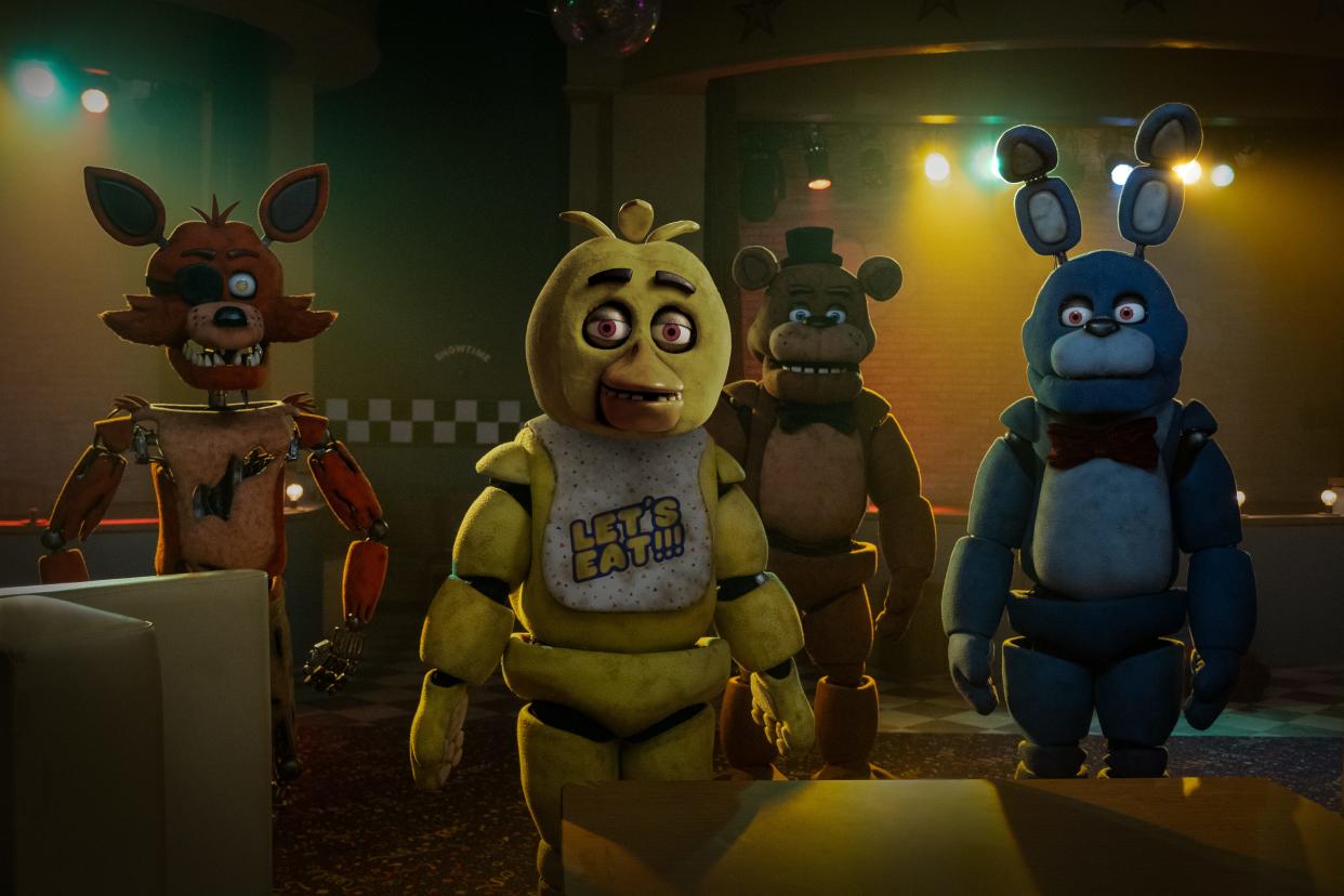 The murderous and animatronic Foxy (far left), Chica, Freddy Fazbear and Bonnie come alive in the horror movie "Five Nights at Freddy's."