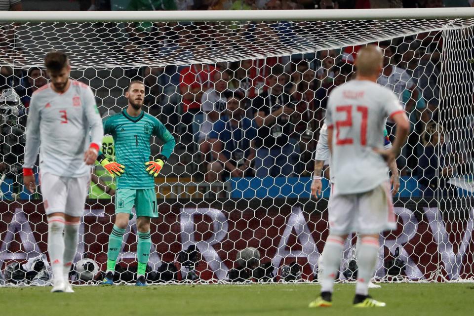 <p>Sorry amigos: De Gea reacts after conceding Spain’s second goal to Ronaldo. (EFE) </p>