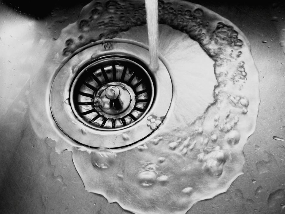 close up of water running on sink