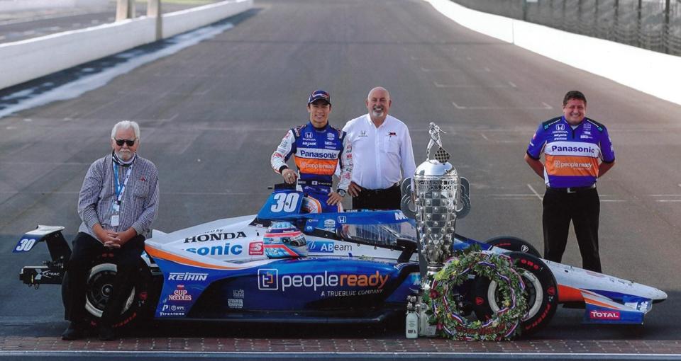 Team co-owner Mike Lanigan, driver Takuma Sato, co-owner Bobby Rahal and spotter Brent Wentz pose after winning the 2020 Indy 500.