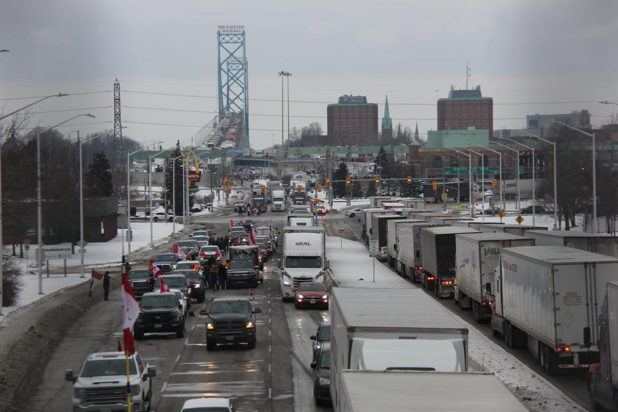 The blockade at the Ambassador Bridge in Windsor, Ont., which attaches to Michigan and cost millions of dollars in lost revenue, pictured in a 2022 file photo.  (Mike Evans/CBC - image credit)