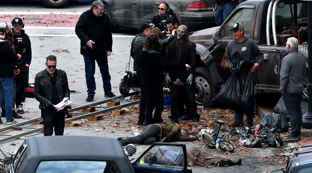 A walker gets a touch up as Worcester's Norwich Street stands in for a smoky New York City for "The Walking Dead: Dead City" filming Monday.