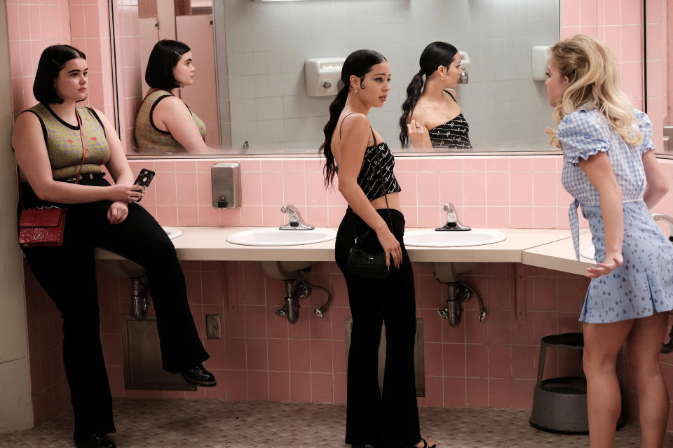 Barbie Ferreira, Alexa Demie, and Sydney Sweeney stand in a bathroom. Alexa and Sydney are facing each other, engaged in a conversation