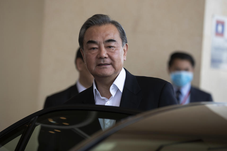 China's Foreign Minister Wang Yi leaves Wattay International Airport in Vientiane, Laos, Wednesday, Feb. 19, 2020. The foreign ministers of the Association of Southeast Asian Nations are meeting in Laos Thursday to discuss ways to curb the spread of the new virus infections. (AP Photo/Sakchai Lalit)