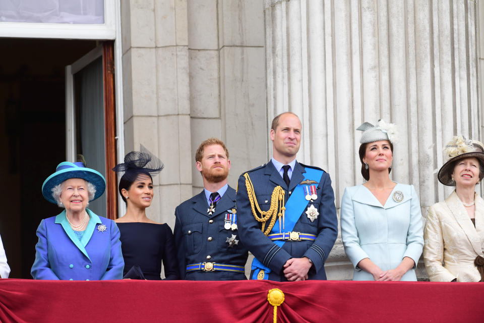 Britain's Queen Elizabeth, Meghan, Duchess of Sussex, Prince Harry, Prince William, and Catherine, Duchess of Cambridge stand on the balcony of Buckingham Palace as they watch a fly past to mark the centenary of the Royal Air Force in central London, Britain July 10, 2018. Paul Grover/Pool via Reuters