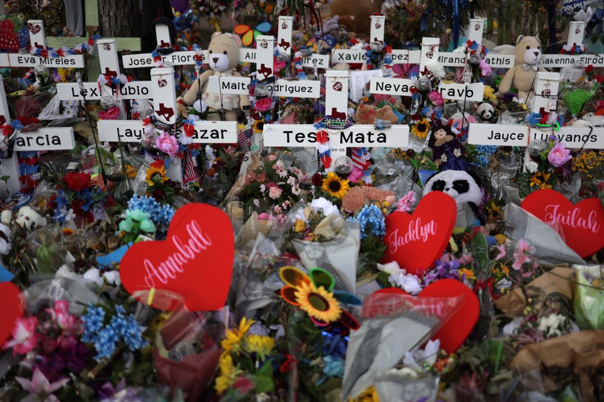 Wooden crosses are placed at a memorial dedicated to the victims of the mass shooting at Robb Elementary School in Uvalde, Texas on June 3, 2022.